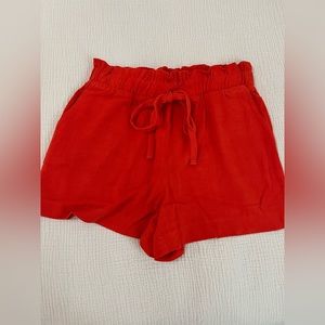 Bright orange drawstring shorts